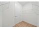 Large walk-in closet with wire shelving and wood-look floors at 1483 Japan St, North Port, FL 34288