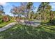 Outdoor shuffleboard court nestled amongst palms at 1515 Forrest Nelson Blvd # H204, Port Charlotte, FL 33952