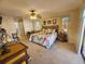 Relaxing main bedroom with a king-size bed and access to the bathroom at 15240 Buswell Ave, Port Charlotte, FL 33953