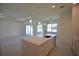 Open kitchen with large island and white cabinetry at 17263 Tampico Ln, Punta Gorda, FL 33955