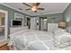Spacious bedroom with a queen bed, dresser, and access to a balcony at 2000 Bal Harbor Blvd # 321, Punta Gorda, FL 33950