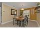 Bright dining room with wood table and gray chairs at 2000 Bal Harbor Blvd # 321, Punta Gorda, FL 33950