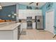 Bright kitchen featuring stainless steel appliances and white cabinets at 2000 Bal Harbor Blvd # 321, Punta Gorda, FL 33950
