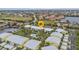 Aerial view of waterfront community, featuring a pool and lush landscaping at 2000 Bal Harbor Blvd # 321, Punta Gorda, FL 33950