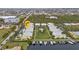 Stunning aerial view of the condo community with manicured lawns, boat docks, and a sparkling pool for relaxing and enjoying at 2000 Bal Harbor Blvd # 321, Punta Gorda, FL 33950