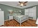 Comfortable bedroom featuring hardwood floors and a ceiling fan at 2000 Bal Harbor Blvd # 321, Punta Gorda, FL 33950