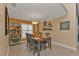 Charming dining room with a wooden table and shelving at 2000 Bal Harbor Blvd # 321, Punta Gorda, FL 33950