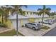 Attached two-car garage with a paved driveway and parked silver SUV, showcasing convenience and ample parking space at 2000 Bal Harbor Blvd # 321, Punta Gorda, FL 33950