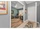 Cozy office space with a relaxing chair, wood-look floors, and ample natural light, ideal for work or relaxation at 2000 Bal Harbor Blvd # 321, Punta Gorda, FL 33950