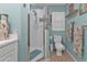 Clean bathroom with shower, toilet and light teal walls at 2000 Bal Harbor Blvd # 321, Punta Gorda, FL 33950