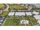 Aerial view showing condo building, pool, and surrounding area at 2000 Bal Harbor Blvd # 321, Punta Gorda, FL 33950