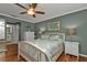 Comfortable bedroom with a queen bed, ceiling fan, and an ensuite bathroom at 2000 Bal Harbor Blvd # 321, Punta Gorda, FL 33950
