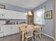 Bright kitchen nook features a wooden table and chairs, offering a casual dining space at 2335 Music Ln, North Port, FL 34286