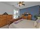 Main bedroom with wooden furniture and access to the backyard at 2335 Music Ln, North Port, FL 34286