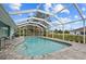 Relaxing pool area with screened enclosure and tiled deck at 25151 Rosamond Ct, Punta Gorda, FL 33983