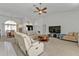 Spacious living room with access to the pool and comfortable seating at 25373 Tether Ln, Punta Gorda, FL 33983