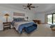Spacious main bedroom with pool view, king bed, and ample closet space at 25373 Tether Ln, Punta Gorda, FL 33983