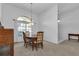 Bright dining room with a wooden table and four chairs at 25373 Tether Ln, Punta Gorda, FL 33983