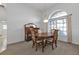 Bright dining room with a wooden table and four chairs at 25373 Tether Ln, Punta Gorda, FL 33983