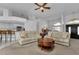 Spacious living room with neutral carpeting, recessed lighting and comfortable seating at 25373 Tether Ln, Punta Gorda, FL 33983