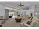 Spacious living room with access to the pool and comfortable seating at 25373 Tether Ln, Punta Gorda, FL 33983