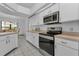 Modern kitchen with stainless steel appliances at 25373 Tether Ln, Punta Gorda, FL 33983