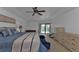 Main bedroom with king-size bed, dresser, and access to the pool at 25373 Tether Ln, Punta Gorda, FL 33983