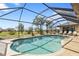 Large screened-in pool with lounge chairs at 25373 Tether Ln, Punta Gorda, FL 33983