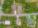 Aerial shot of two houses surrounded by beautiful foliage and trees at 2643 Rushmore St, North Port, FL 34288