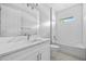 This bathroom features a single sink, vanity, mirror, and shower with a tub at 2643 Rushmore St, North Port, FL 34288