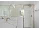 Bathroom features a quartz countertop, sink, subway tile shower, and a clear glass door at 2643 Rushmore St, North Port, FL 34288