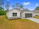 Charming single-story home featuring a two-car garage and neutral color palette at 2643 Rushmore St, North Port, FL 34288