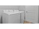 Laundry room featuring a new, white, side-by-side washer and dryer at 2643 Rushmore St, North Port, FL 34288