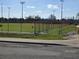 Well maintained baseball field with seating and lights at 301 Country Club Way, Venice, FL 34285