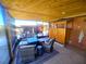 Relaxing screened patio with seating area and fire pit at 301 Country Club Way, Venice, FL 34285