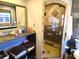 Bathroom with walk in shower and tropical design at 301 Country Club Way, Venice, FL 34285