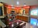 Modern kitchen with granite countertops and stainless steel appliances at 301 Country Club Way, Venice, FL 34285
