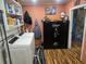 Laundry room with washer, dryer, and shelving at 301 Country Club Way, Venice, FL 34285