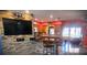 Kitchen features granite countertops, wood cabinets, and a breakfast bar at 301 Country Club Way, Venice, FL 34285