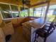 Outdoor kitchen with bar and concrete countertop at 301 Country Club Way, Venice, FL 34285