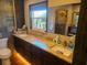 Bathroom with granite double vanity and walk-in shower at 301 Country Club Way, Venice, FL 34285