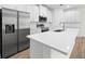 Modern kitchen with white cabinets and quartz countertops at 3705 Baynes Rd, North Port, FL 34288