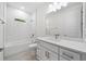 Clean bathroom with white subway tile, a bathtub, and a vanity with a quartz countertop at 3705 Baynes Rd, North Port, FL 34288