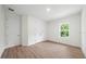 Spacious bedroom with double doors and a large window at 3705 Baynes Rd, North Port, FL 34288
