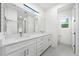 Bathroom with double vanity and access to toilet area at 3705 Baynes Rd, North Port, FL 34288