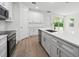 Modern kitchen with white cabinets and quartz countertops at 3705 Baynes Rd, North Port, FL 34288