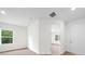 Bright bedroom with wood-look floors and large window at 3705 Baynes Rd, North Port, FL 34288