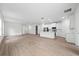 Open concept living room and kitchen with light wood flooring at 3705 Baynes Rd, North Port, FL 34288