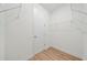 Walk-in closet with wire shelving and wood flooring at 3705 Baynes Rd, North Port, FL 34288