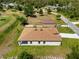 Aerial view of a single story home with a well-maintained backyard and lush landscaping at 3779 Clearfield St, North Port, FL 34286